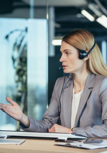 female-employee-call-center-video-link-tech-support-employee-uses-headset-webcam